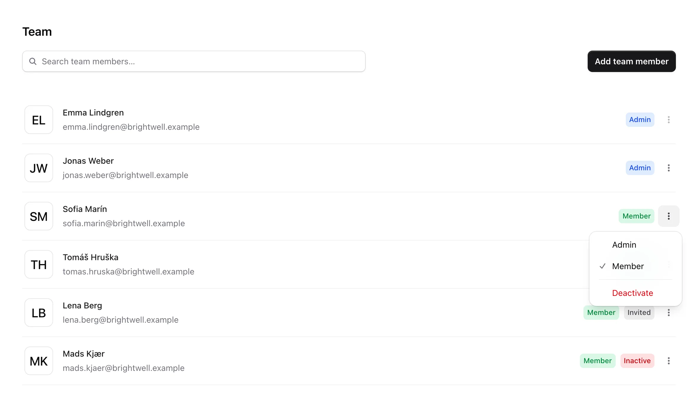 The Team page, with each person's role and status and the options menu open